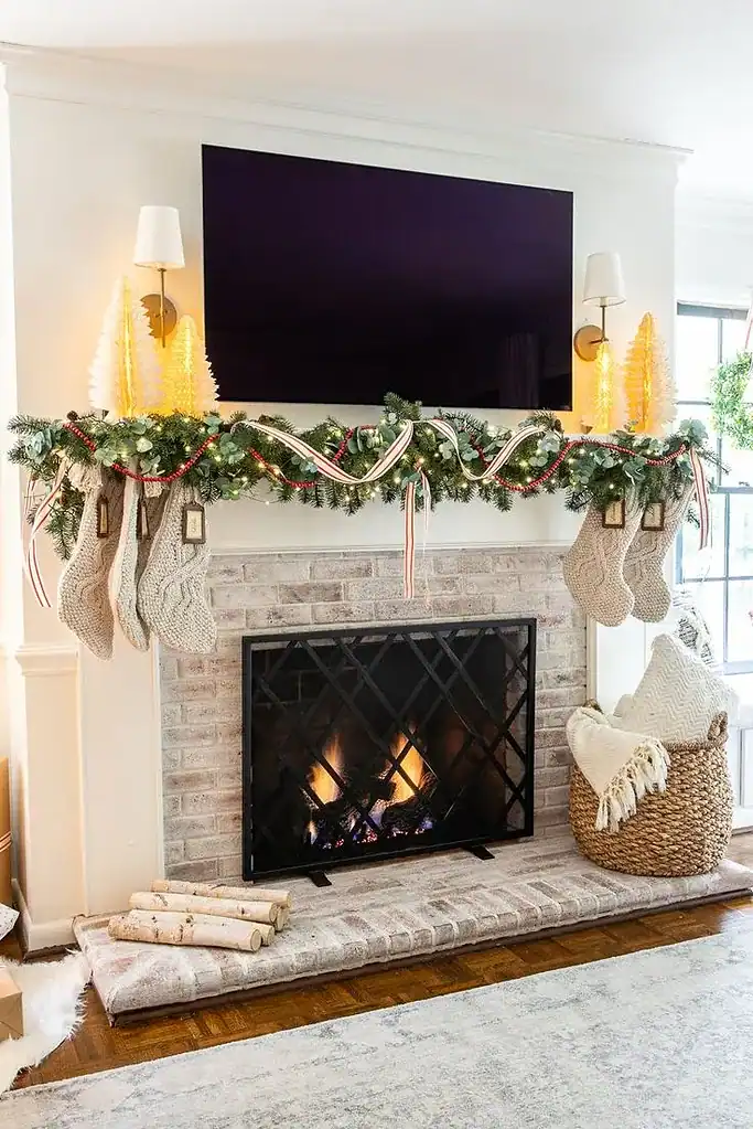 26 Delightful Christmas Mantel Decor Ideas for a Festive Home 25 Christmas mantel with a TV